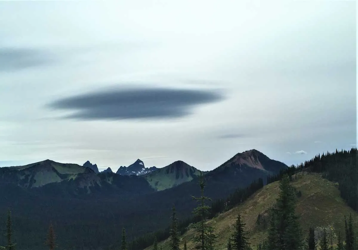 Dark lenticular cloud above Manning Park mountain ridges